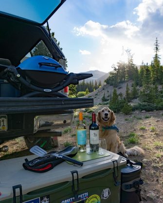 Four tips for car camping in comfort – Campsite with a view, Air mattress for a good night sleep, Line 39 wine and cheese for happy hour and a Weber® Grill for cooking dinner AD Msg 4 21+